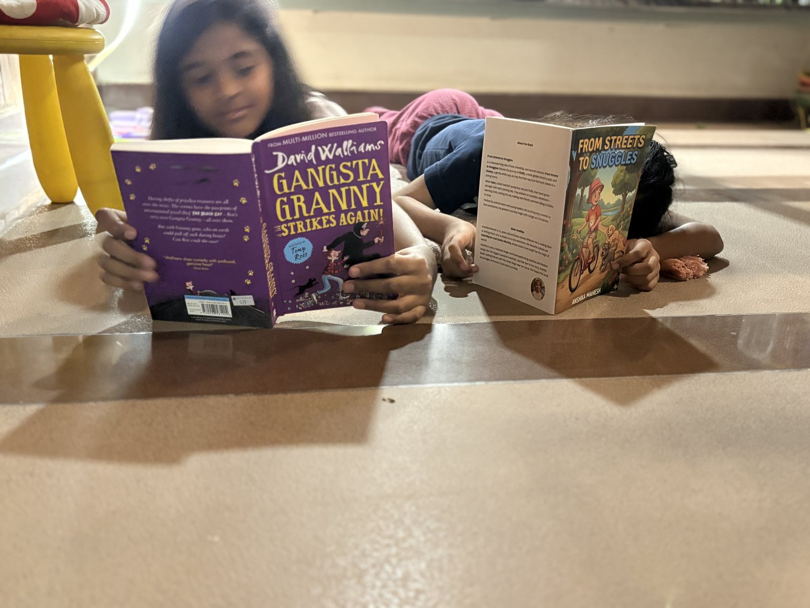 Anshika reading with a friend