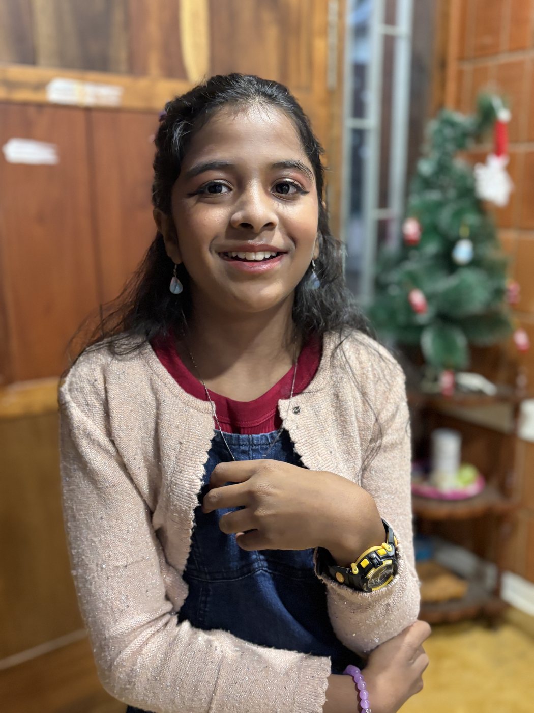Anshika smiling at home